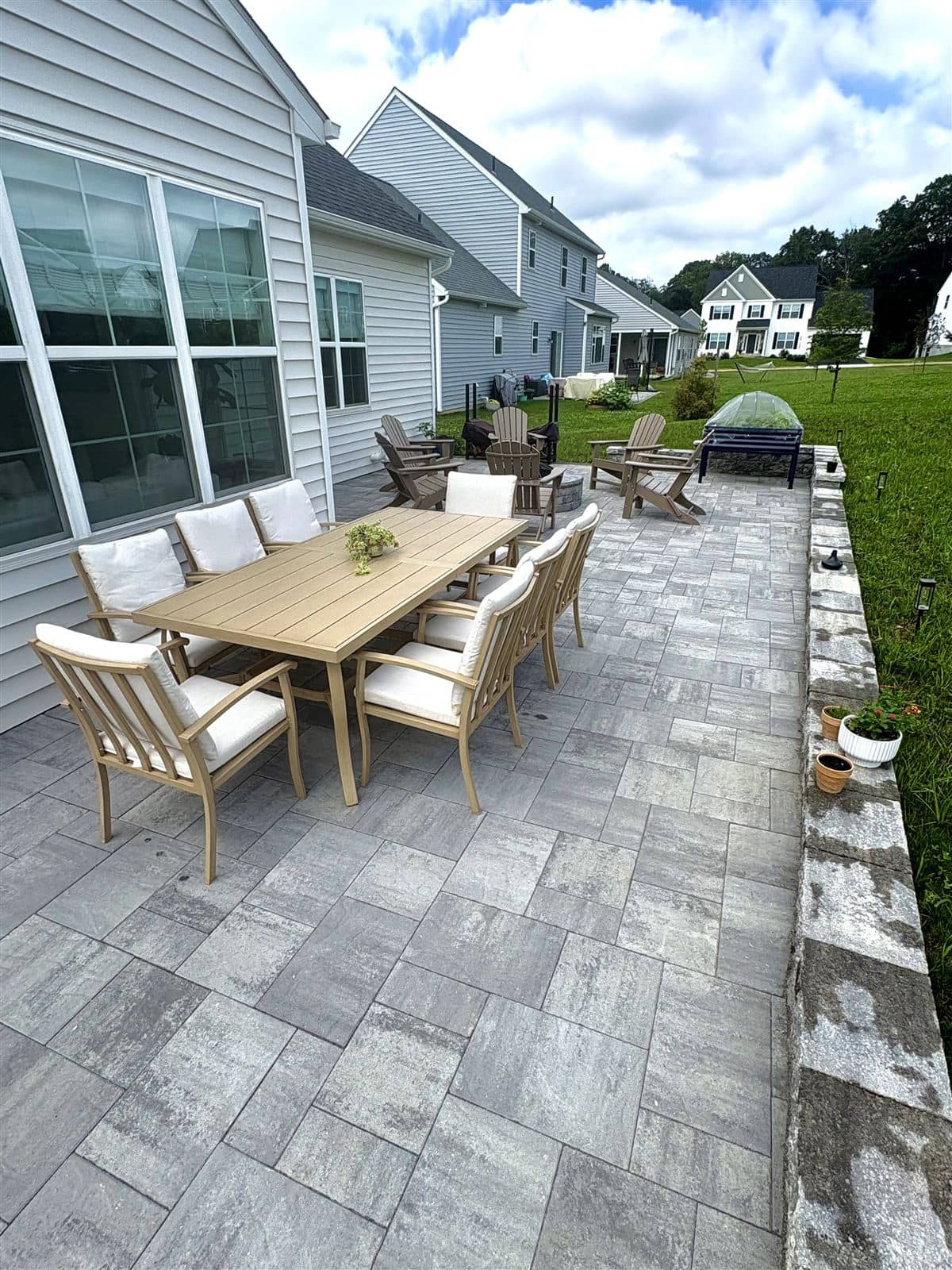 Built-in fire pit on the new paver patio