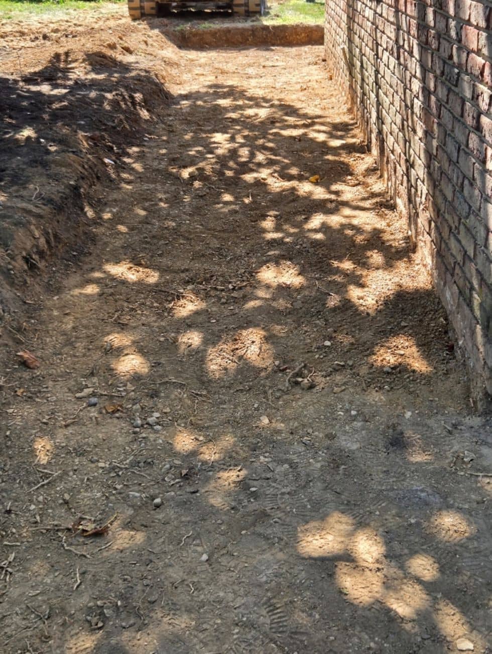 Clearing out the old cracked patio