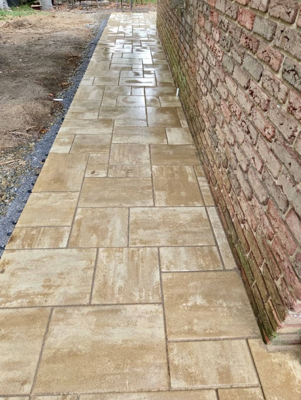 New patio and walkway wrapping the side of the house